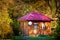 Holiday apartment - wooden cottage house in forest in early autumn