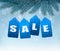 Holiday background with blue sale tags.