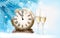 Holiday background with champagne glasses and clock. Happy New Y
