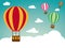 Holiday background with hot air balloon on retro colored blue sky with clouds