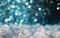 Holiday background with white snow crystals and brilliant blue sparks and circles