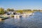 Holiday boats and cruisers moored up in a boat yard