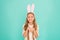 Holiday bunny girl posing with cute long ears. Child smiling play bunny role. Happy childhood. Traditions for kids to