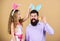 Holiday bunny long ears. Family tradition concept. Family dad and daughter wear bunny ears. Father and child celebrate