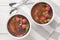 Holiday chocolate creme brulee with berry on top close-up in a ramekin. Horizontal top view