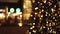 Holiday Christmas lights glowing in darkness in city streets in night time. Footage of city night with abstract colorful bokeh