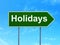 Holiday concept: Holidays on road sign background