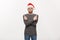 Holiday Concept - Young beard man in sweater enjoy playing and pointing finger onside with copyspace.