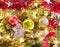 Holiday cookie hanging from fully decorated Christmas tree