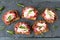 Holiday cracker appetizers with cranberry cheese, above on slate