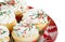 Holiday cupcakes with vanilla frosting, red and green sprinkles