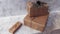 Holiday delivery boxes, parcels wrapped in brown paper, decorated and tied with rough twine, stone background