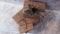 Holiday delivery boxes, parcels wrapped in brown paper, decorated and tied with rough twine, stone background