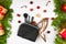 Holiday discounts and shopping concept, flat barking. Christmas composition of women`s accessories, cosmetic bag with cosmetics,