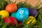 holiday Easter eggs in basket with grass