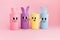 Holiday easy DIY craft idea for kids. Toilet paper roll tube toy\\\'s rabbit and chick on pink background