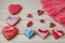 Holiday glazed honey heart shaped cakes lay on wooden table