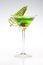 A Holiday Green Appletini with tree decor on the side.