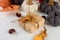 Holiday greeting card with Knitted decorative pumpkins, gifts, fall leaves, chestnuts