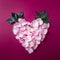 Holiday heart-shaped wreath made from light rose petals on red background, Valentine`s card
