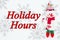 Holiday hours message with snowman with snowflakes