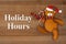 Holiday Hours sign with cute Santa bear