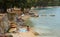 Holiday makers enjoying the beaches on the Golden Cape Forest Park Rovinj Croatia.