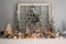 Holiday mantel decorated with flocked garland and wreath