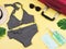 Holiday and new normal concept, top view of   stripe pattern  bikini swimsuit and women`s vacation accessories items with surgica