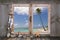Holiday in paradise: wooden window sill with view to the beach.
