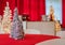 Holiday Party in red and white themed decor, silver tinsel tree in focus