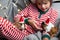 Holiday Pets Christmas guinea pig Cute boy hugs his pets guinea pig Boy in red Santa Hat