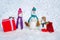 Holiday poster design. Funny group of snowmen family hold Christmas gift. Snowman with shopping bag and gift on the