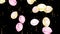 Holiday seamless background with yellow and pink flying balloons and shining confettis with Alpha channel.