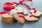 Holiday sweets. Swedish christmas gingerbread cookies pepparkakor, decorated with a red ribbon, on a dark gray background,