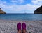 Holiday time - narrow Mediterranean beach with lonely yacht