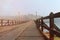 Holiday and travel,landscape perspective wood bridge old with mist