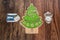Holiday tree and ornaments with various message essential retro tags, isolated on old classic vintage hardwood background