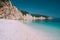 Holiday vacation scene. Fteri beach on Kefalonia Island, Greece. Most beautiful pebble beach with clear emerald blue sea