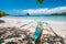 Holiday vibes. Traditional fishermen banca boat on sandy empty tropical beach. Blue ocean lagoon in background. El Nido