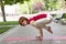 Holiday woman doing yoga pose meditation in the public park Sport Healthy concept