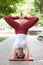 Holiday woman doing yoga pose meditation in the public park Sport Healthy concept