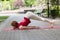 Holiday woman doing yoga pose meditation in the public park Sport Healthy concept