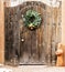 Holiday Wreath on a Wooden Entryway in Santa Fe, New Mexico