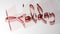 `Holiday` written with reddish semi-transparent 3D letters, on white surface