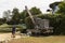 Holidaymakers view an old crane on the water from of Herm Island in the Channel Isles