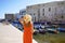 Holidays in Apulia, Italy. Back view of beautiful fashion girl enjoying view of Monopoli ancient port in Apulia, Italy. Summer