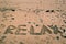 Holidays background with RELAX word written on sandy beach. Holidays background. Summer. In relax mood