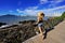 Holidays in Balneario Camboriu, Brazil. Rear view of beautiful stylish girl enjoying view of Balneario Camboriu skyline on