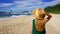 Holidays in Brazil. Panoramic view of traveler girl on Praia do Buraco beach with Balneario Camboriu skyline, Brazil